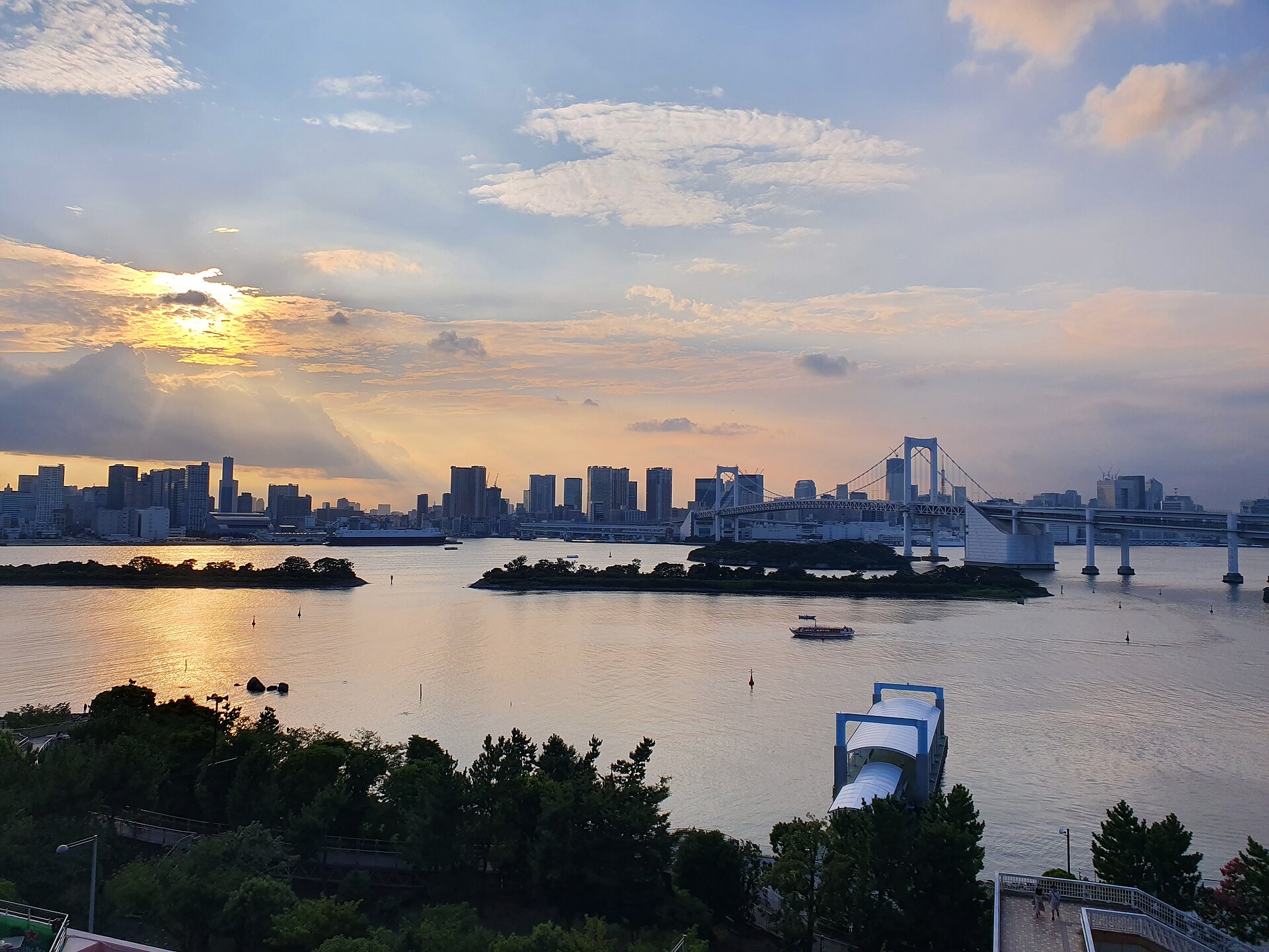 Tokyo Bay and Rainbow Bridge at sunset viewed from Odaiba